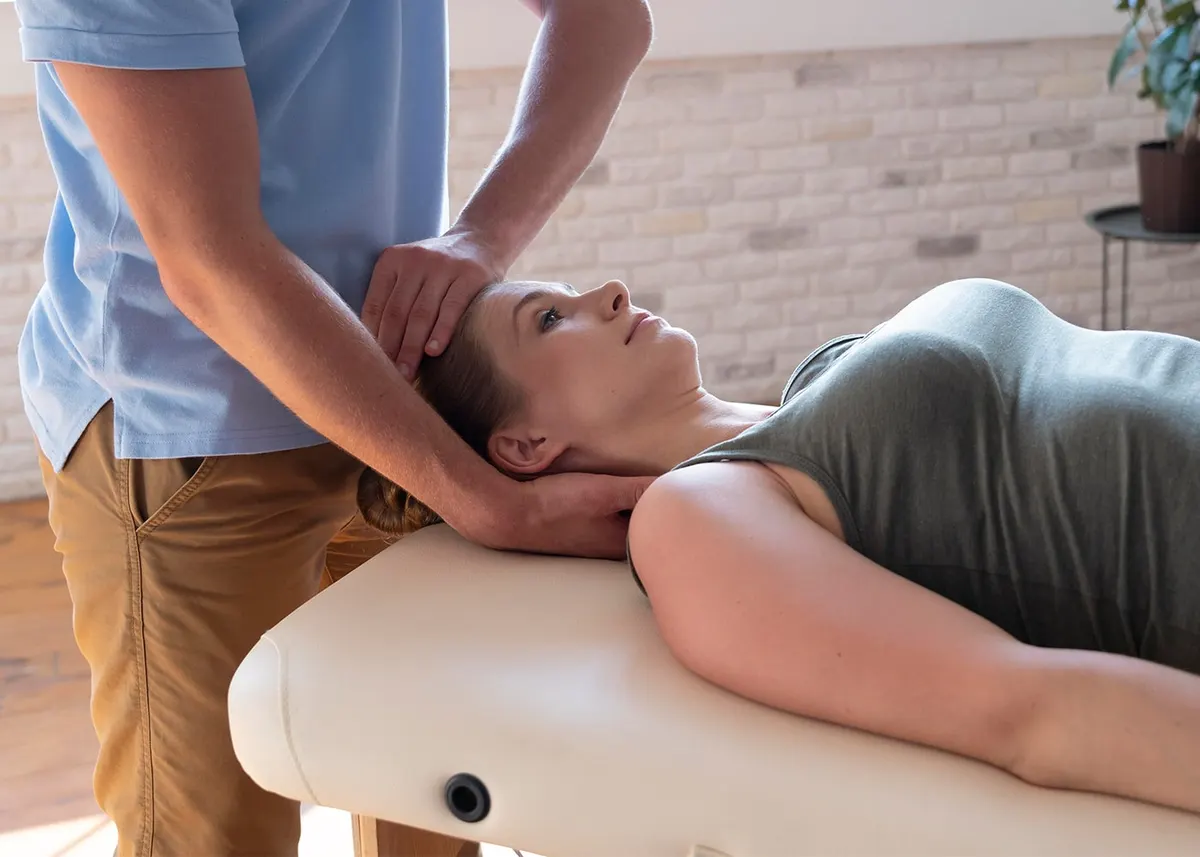 Therapist performing manual therapy on a patient’s neck